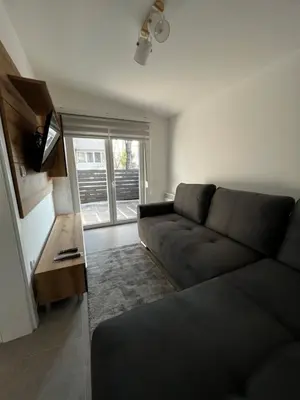 a living room with a couch and a table at Ortak Apartments in Belgrade