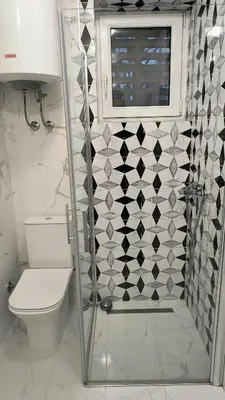a bathroom with a shower with a toilet and a window at TALIJA in Vračar (historical)