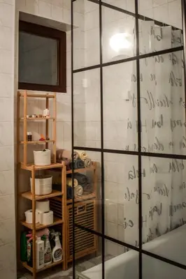 a bathroom with a mirror with writing on the wall at Lana's home in the best part of the city in Vračar (historical)