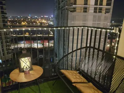 a balcony with a bench and a table on a balcony at Belgrade Waterfront Apartment - Beograd na vodi in Belgrade