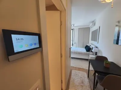 a room with a flat screen tv on a wall at Belgrade Waterfront Apartment - Beograd na vodi in Belgrade