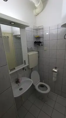 a bathroom with a toilet and a sink at Savska - Apartment in Sajmište