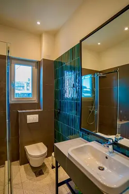 a bathroom with a sink and a toilet and a shower at Miha Premium Apartment in Belgrade
