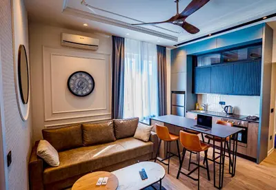 a living room with a couch and a table at Miha Premium Apartment in Belgrade
