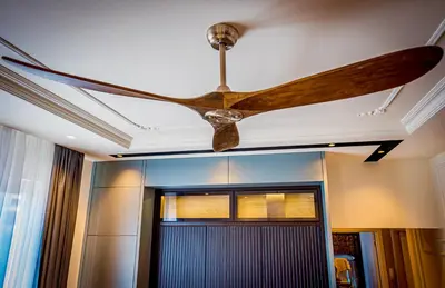 a ceiling fan in a room with a door at Miha Premium Apartment in Belgrade