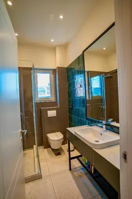 a bathroom with a sink and a toilet at Miha Premium Apartment in Belgrade
