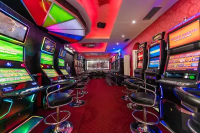 a casino with a bunch of slot machines at Hotel Villa Sarto in Belgrade