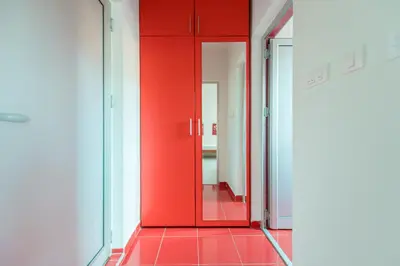 a red door in a room with a red floor at Hotel Villa Sarto in Belgrade