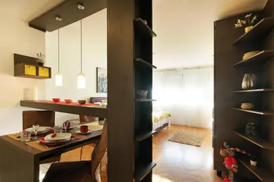 a kitchen with a table and a dining room at Apartment Paradise Serenity in Belgrade