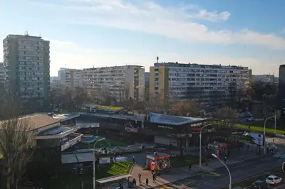 a city with tall buildings and a street with a bus at Apartment Paradise Serenity in Belgrade