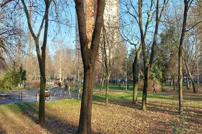 a park with a bunch of trees and a bench at Apartment Paradise Serenity in Belgrade