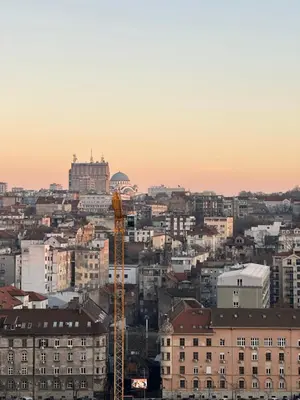 a view of a city with buildings and a crane at Skyway Apartment Belgrade Waterfront in Belgrade