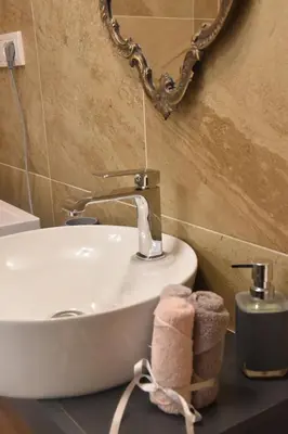 a bathroom with a sink and a mirror at Tiffany Belgrade apartment in Belgrade