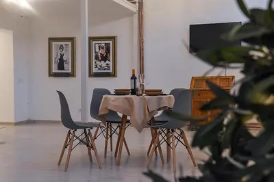 a dining room with a table and chairs at Tiffany Belgrade apartment in Belgrade