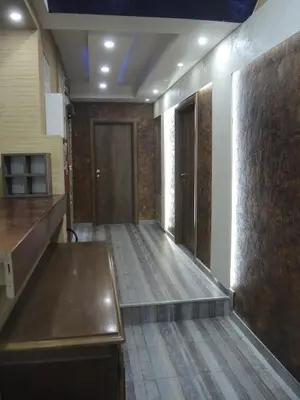 a hallway with a wooden floor and a door at Rooms&Restaurant 43 in Belgrade