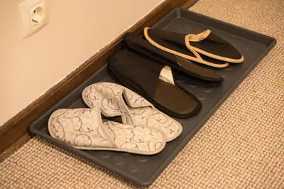 a pair of shoes in a box on the floor at Family & Friends Apt, Skadarlija in Belgrade
