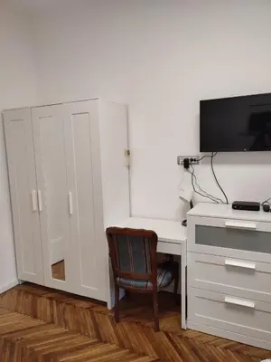 a white desk with a television and a chair at Belgrade apartment Bulevar II in Belgrade