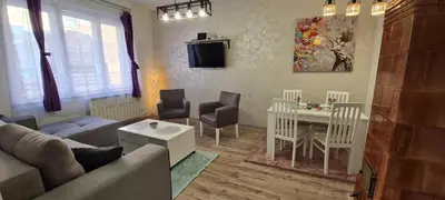 a living room with a couch and a table at JULIJA apartment in Belgrade