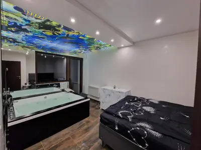 a room with a pool table and a bed at Vila Odiseas in Belgrade