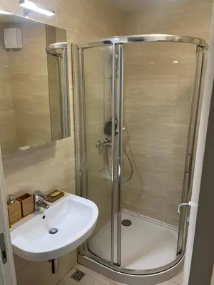 a bathroom with a shower and a sink at Apartment Maximus II lux in Novi Beograd