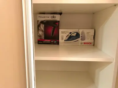 a shelf in a room with some items on it at Apartment Maximus II lux in Novi Beograd