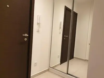 a bathroom with a mirror and a black door at Altina Connect - all new, parking, Netflix in Belgrade