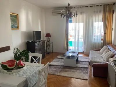 a living room with a couch and a table with fruits on it at Rajana , Beograd - Hram Svetog Save in Vračar (historical)