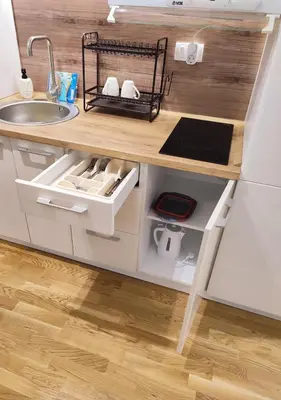a small kitchen with a sink and a counter at TiD Apartman LUX in Arandjelovac