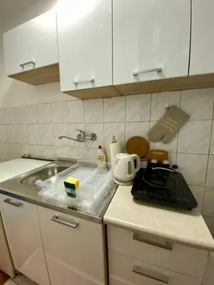 a kitchen with a sink and a counter top at Apartman Espo in Vračar (historical)