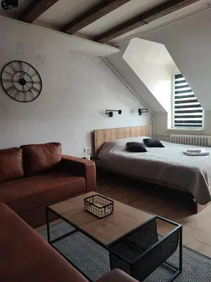 a living room with a bed and a couch at Blackwood Hill in Belgrade