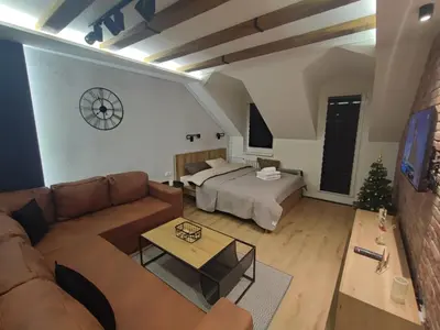 a living room with a bed and a couch at Blackwood Hill in Belgrade