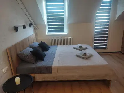 a bedroom with a bed with two towels on it at Blackwood Hill in Belgrade