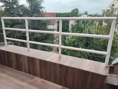 a white railing on top of a balcony at Blackwood Hill in Belgrade