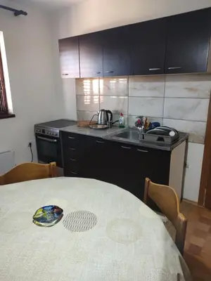 a kitchen with a table and a sink at Vojin Meljak in Meljak