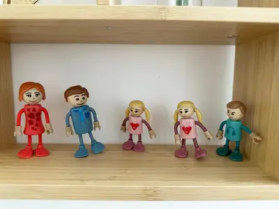 a group of toy dolls sitting on a shelf at Royal Underground Belgrade in Belgrade