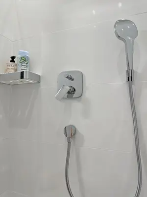a shower head and a faucet in a bathroom at Royal Underground Belgrade in Belgrade