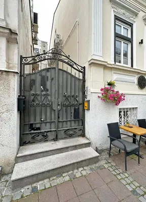 a black gate on the side of a building at Royal Underground Belgrade in Belgrade