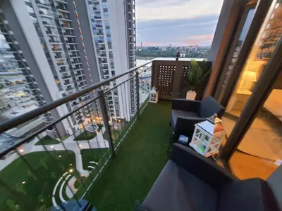 a balcony with chairs and a view of a city at Belgrade Waterfront Lux Apartment in Belgrade