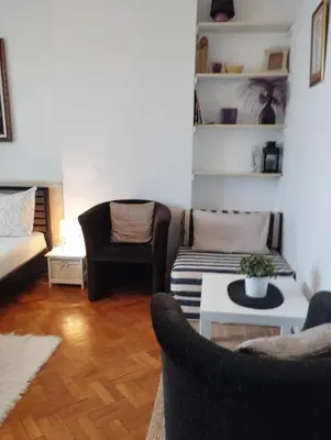 a living room with two couches and a table at Apartman Centar in Belgrade