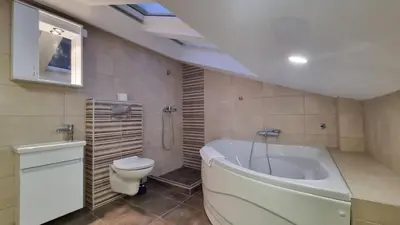 a bathroom with a tub and a toilet and a sink at Apartments near Belgrade Waterfront in Belgrade