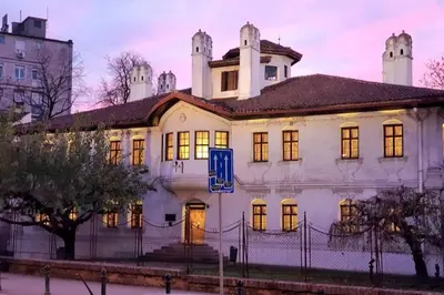 a large white building with a tower on top at Globetrotter's City Center Pied-à-Terre ᯤ in Belgrade
