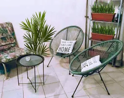 two chairs and a table with a pillow on them at Globetrotter's City Center Pied-à-Terre ᯤ in Belgrade