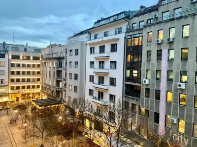 a group of buildings in a city at night at City Center Crown Apartment in Belgrade
