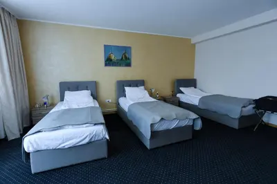 a hotel room with two beds in a room at Smeštaj Tank, Pančevo in Salaši