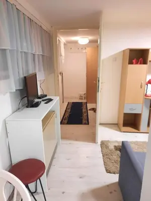 a room with a desk with a computer and a hallway at Apartment Sofija Vracar in Belgrade