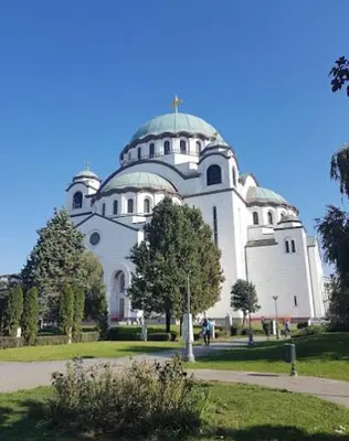 a large white building with a dome on top of it at Apartment Sofija Vracar in Belgrade
