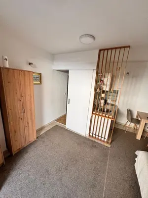 an empty room with a closet and a table at Holiday in Belgrade