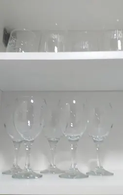 a row of wine glasses sitting on a shelf at Apartman Marina Aranđelovac in Arandjelovac