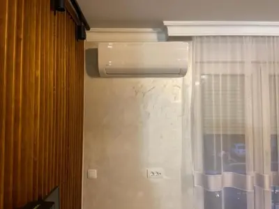 a room with a window with a air conditioner at Stepa in Belgrade