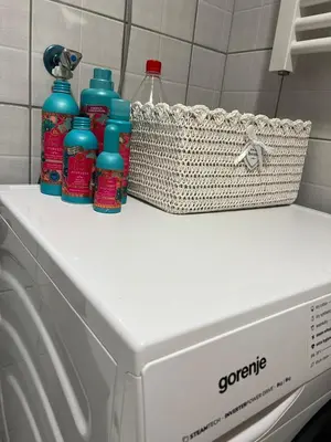 a washing machine with bottles on top of it at Stepa in Belgrade